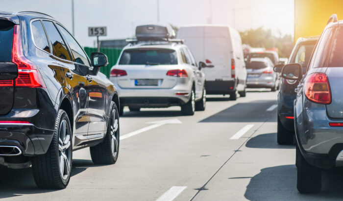 Car rush hours city street. Cars on highway in traffic jam